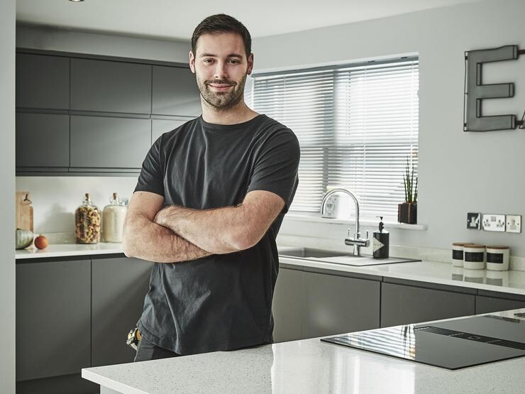 Builder in a completed kitchen
