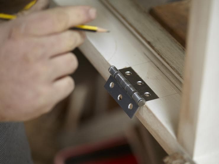 Mark the position - fitting door hinges