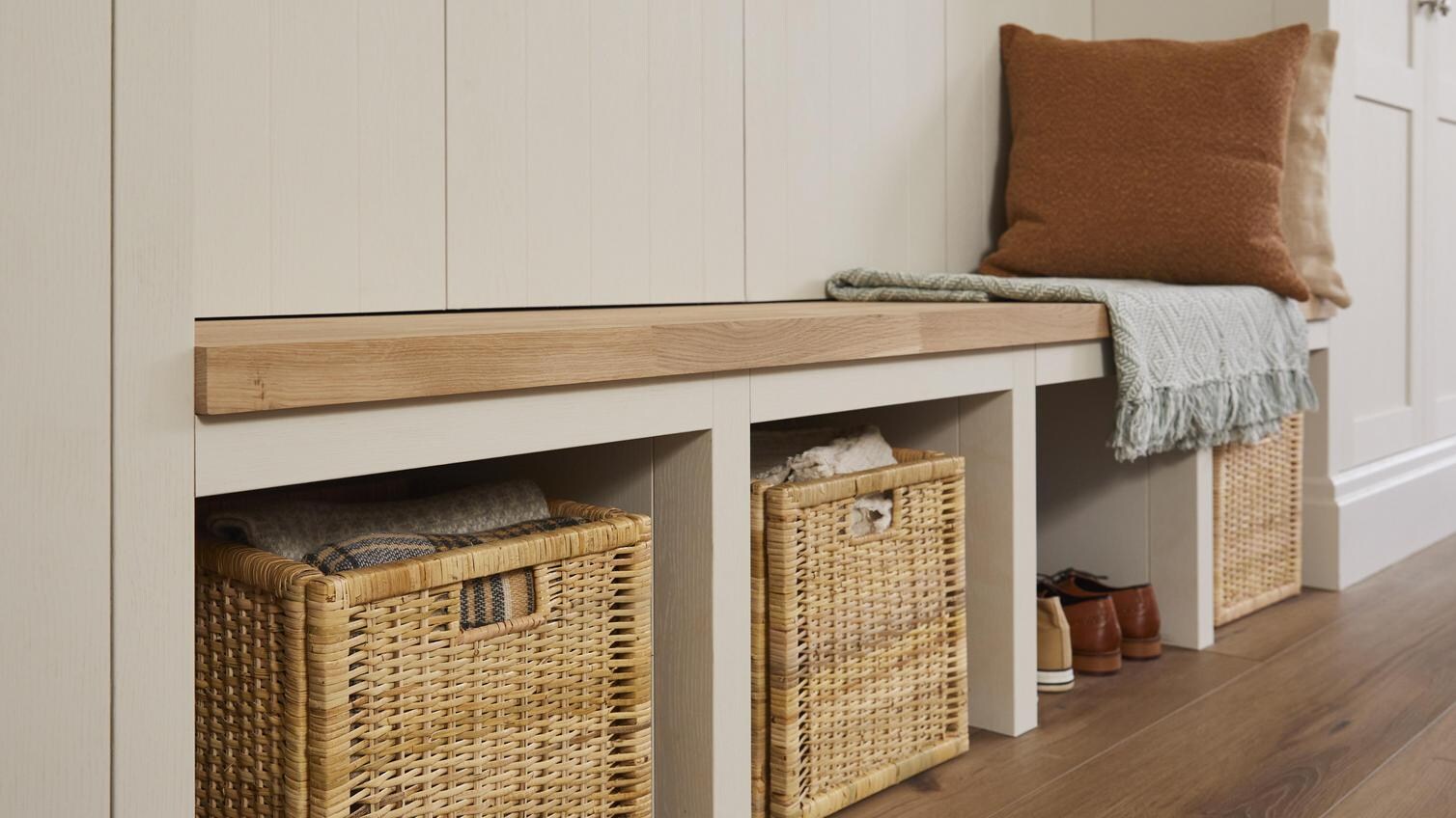 A solid wood worktop used as a bench in a storage area