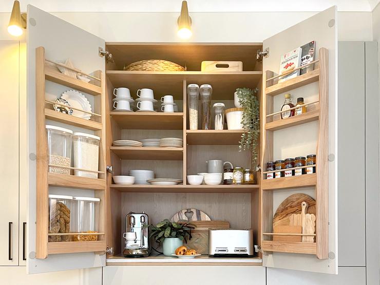 Large kitchen cabinet with internal door balcony storage finished in oak