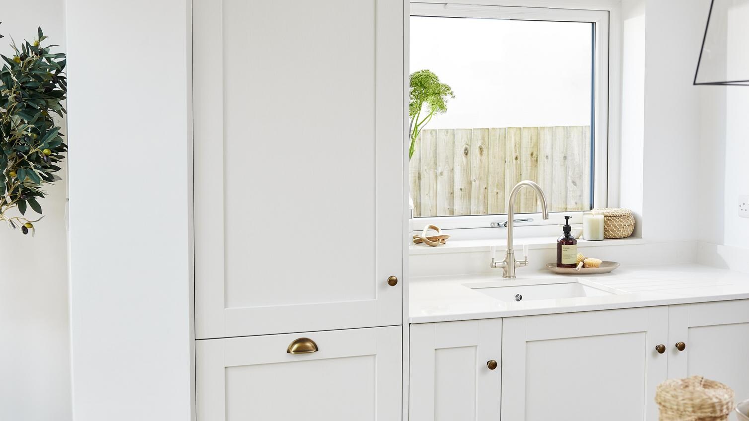 A tower storage cabinet in a porcelain tone