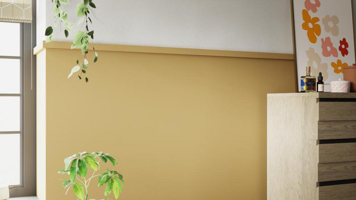 A yellow and white bedroom, with softwood mouldings