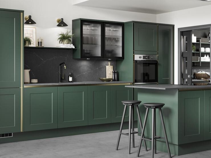 A green, handleless kitchen