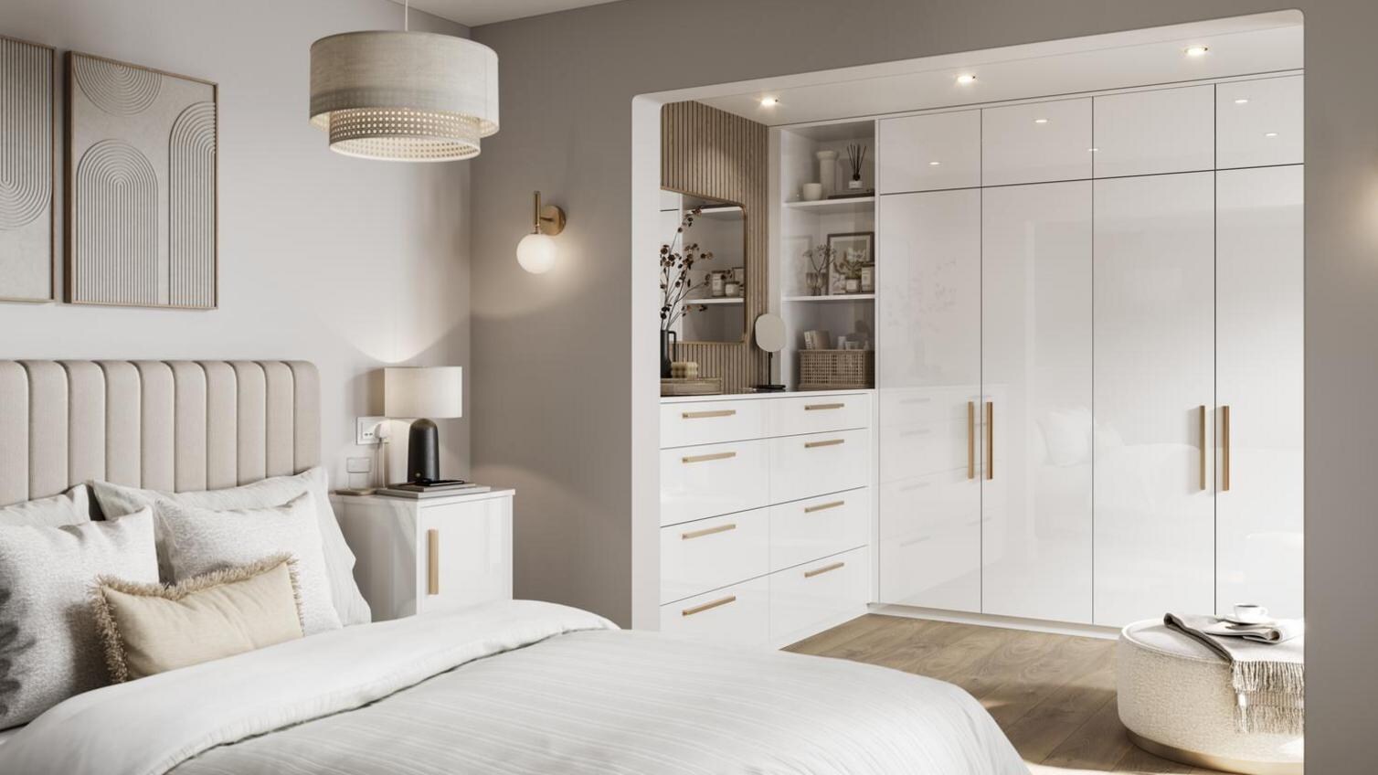 A modern, white bedroom with a gloss finish from Howdens