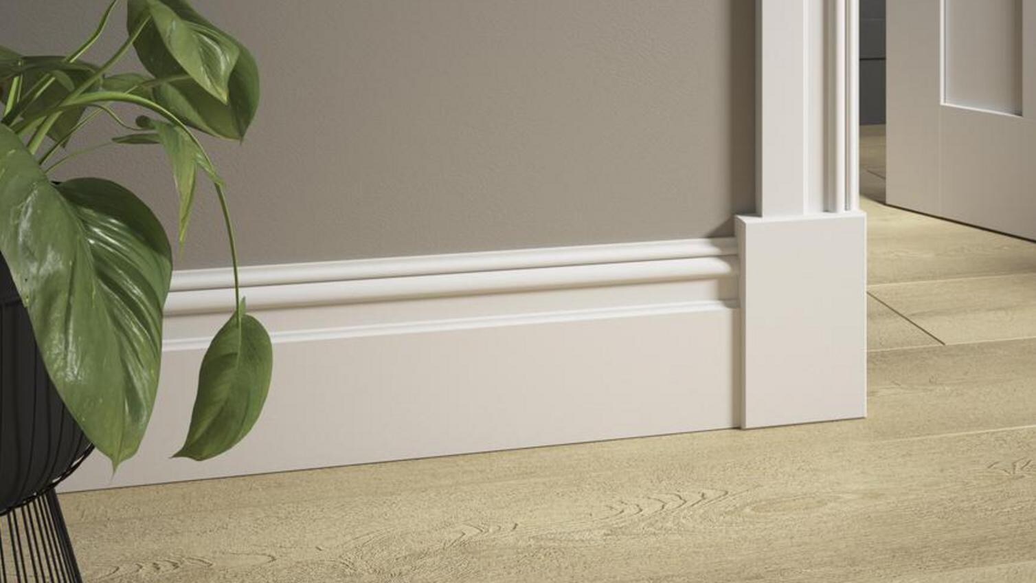 A doorway, with wood effect flooring and Elmbridge skirting