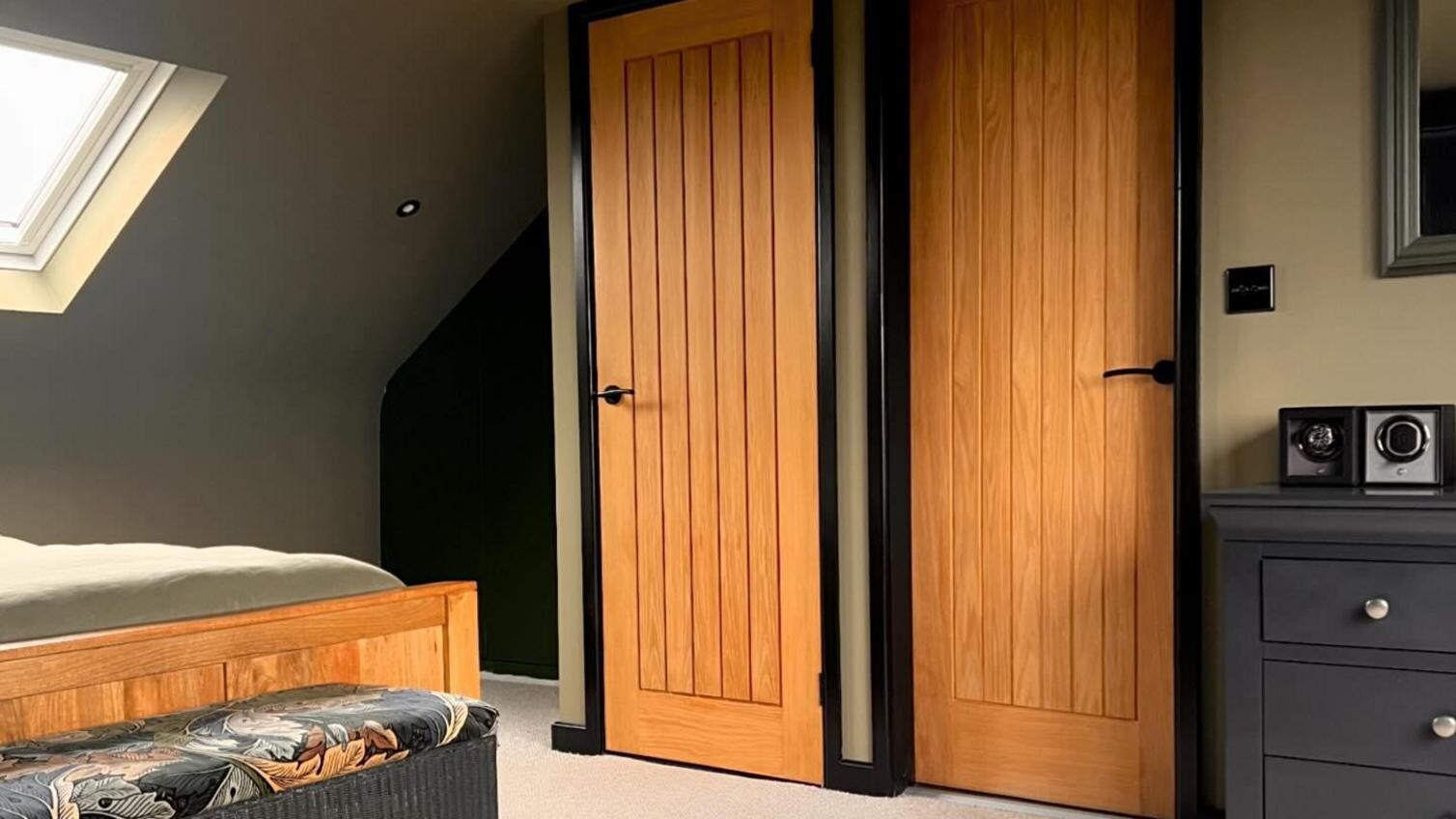 Timber doors in a dark bedroom scheme