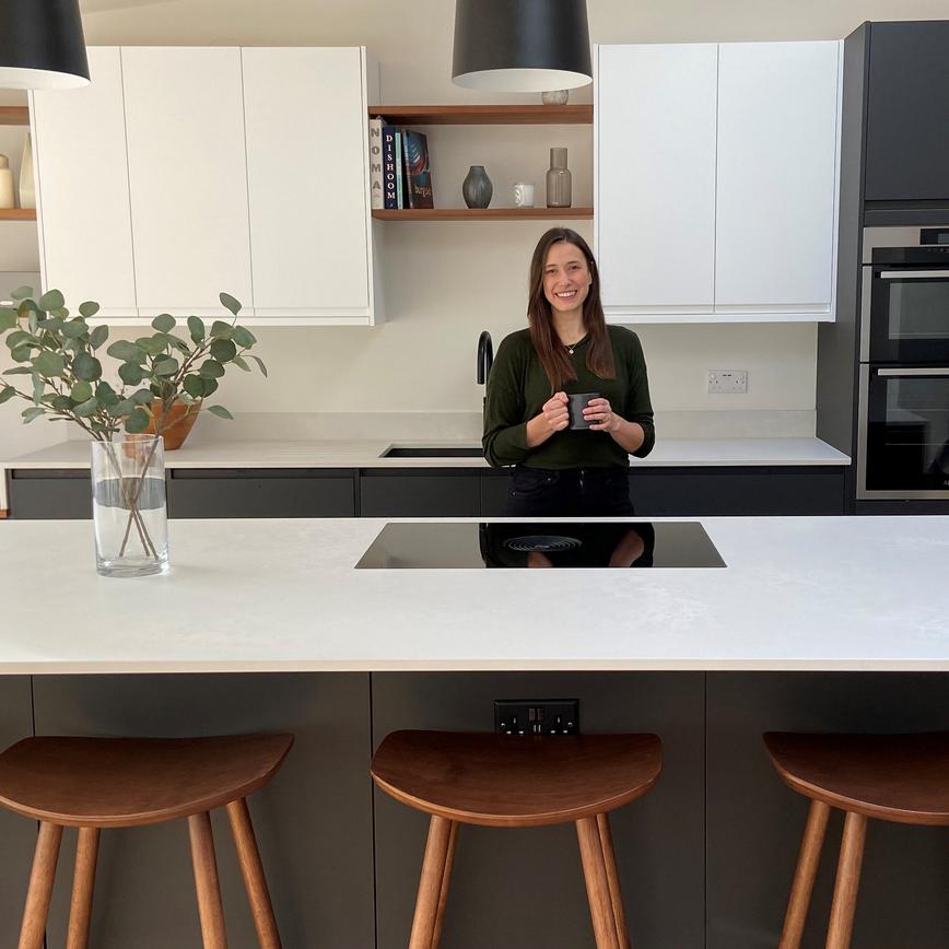 Influencer Sarah Evans in her charcoal and white Clerkenwell kitchen with island