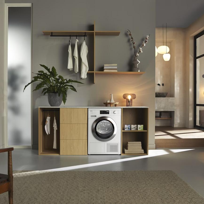 Miele T1 TEL785 WP Freestanding 9kg White Heat Pump Tumble Dryer In a Utility Room