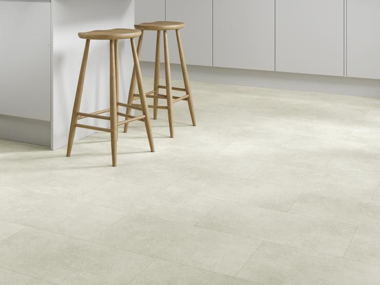 Pale luxury vinyl tones in a stone-effect shade within a kitchen