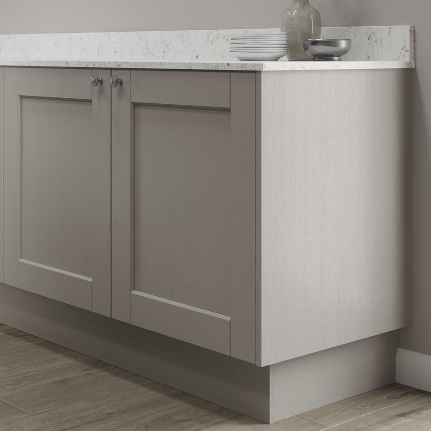 Grained pebble 15mm MFC continuous plinth fitted with base cabinet and white worktop