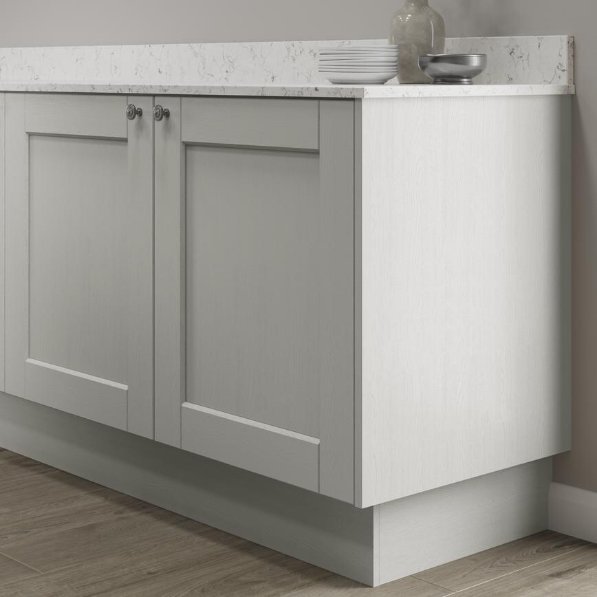 Grained porcelain 15mm MFC continuous plinth fitted with base cabinet and white worktop