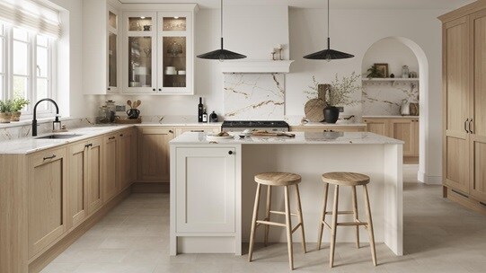 An oak shaker kitchen with in-frame doors with white cabinet island. It is finished with a white worktop and black handles. 