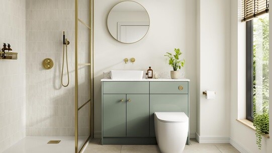 A reed green, slab kitchen in a single wall layout. There are white worktops, tile flooring, gold handles, and a white sink.