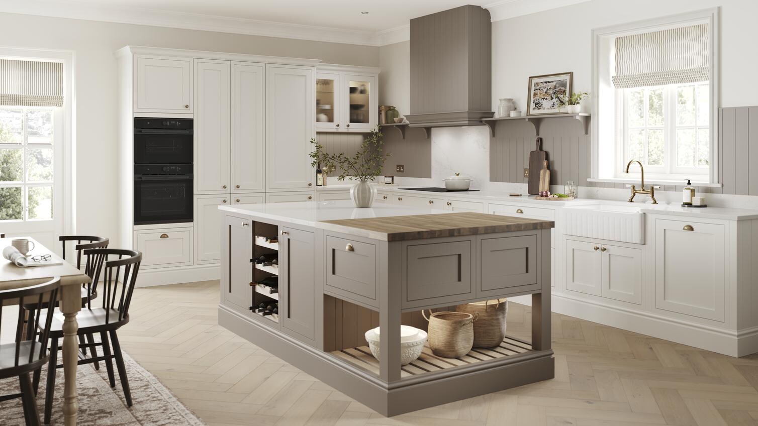 A mushroom brown shaker Ilfracombe kitchen island. It has matching base & tower units in porcelain, & oak-effect flooring. 