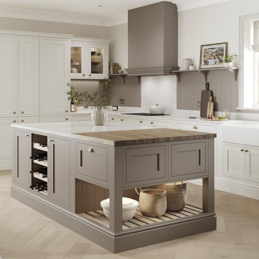 A mushroom brown shaker Ilfracombe kitchen island. It has matching base & tower units in porcelain, & oak-effect flooring. 