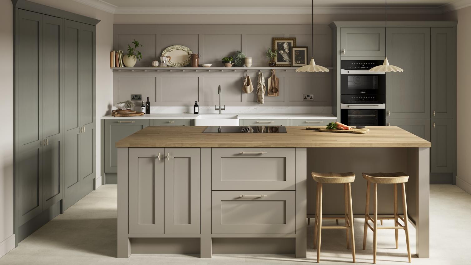 A light estate green kitchen, with shaker doors and an island layout. It has wood worktops and stone-effect flooring.