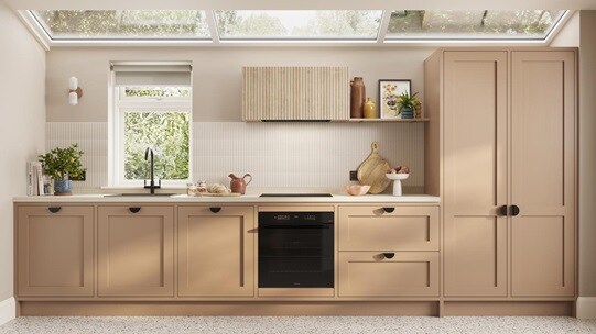 A single wall kitchen featuring teracotta shaker doors. Styled with black handles, a white worktop, and built-under oven.