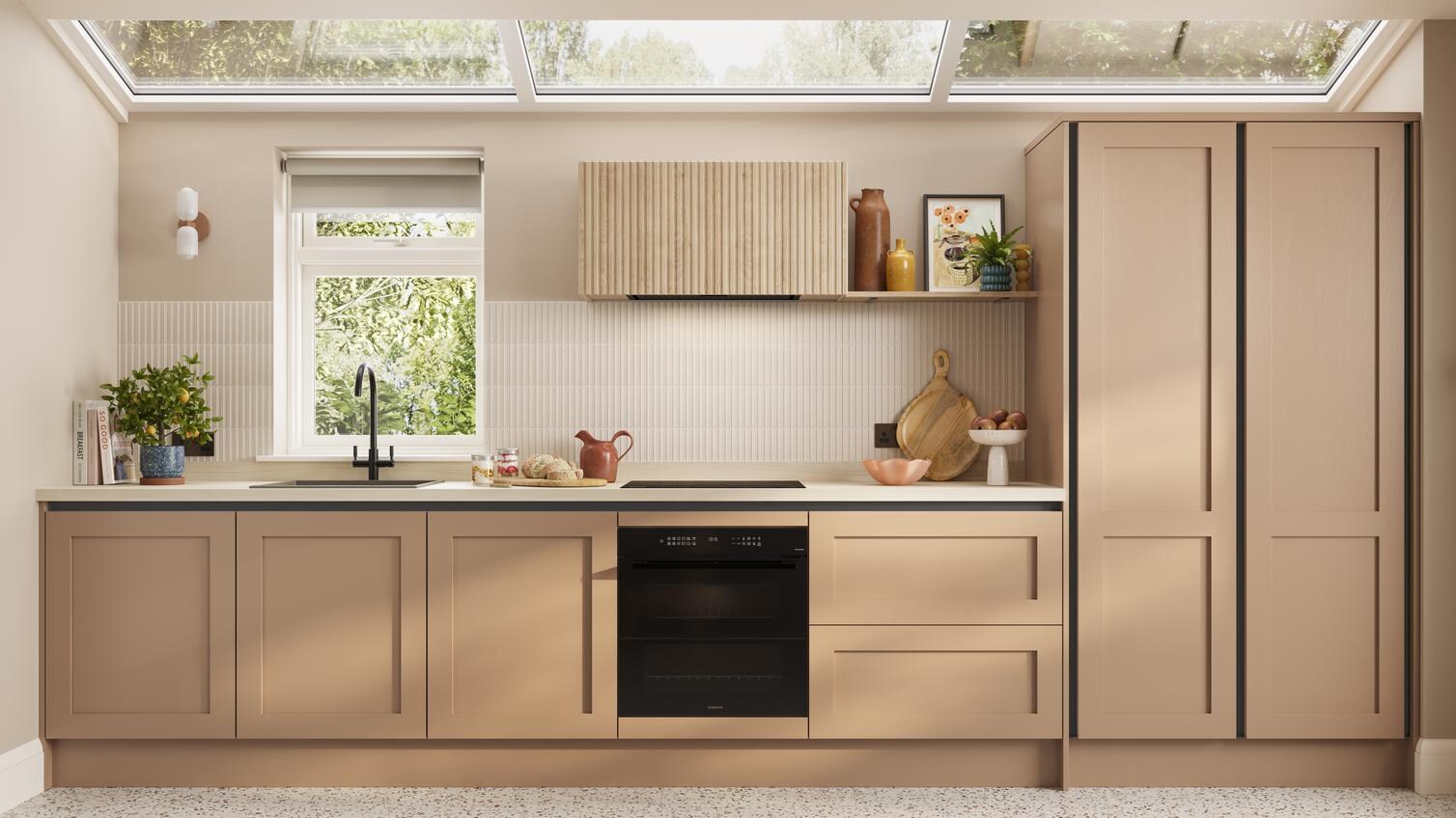 A handleless kitchen idea featuring terracotta cupboards. Includes shaker doors, white worktops, and black metal profiles.