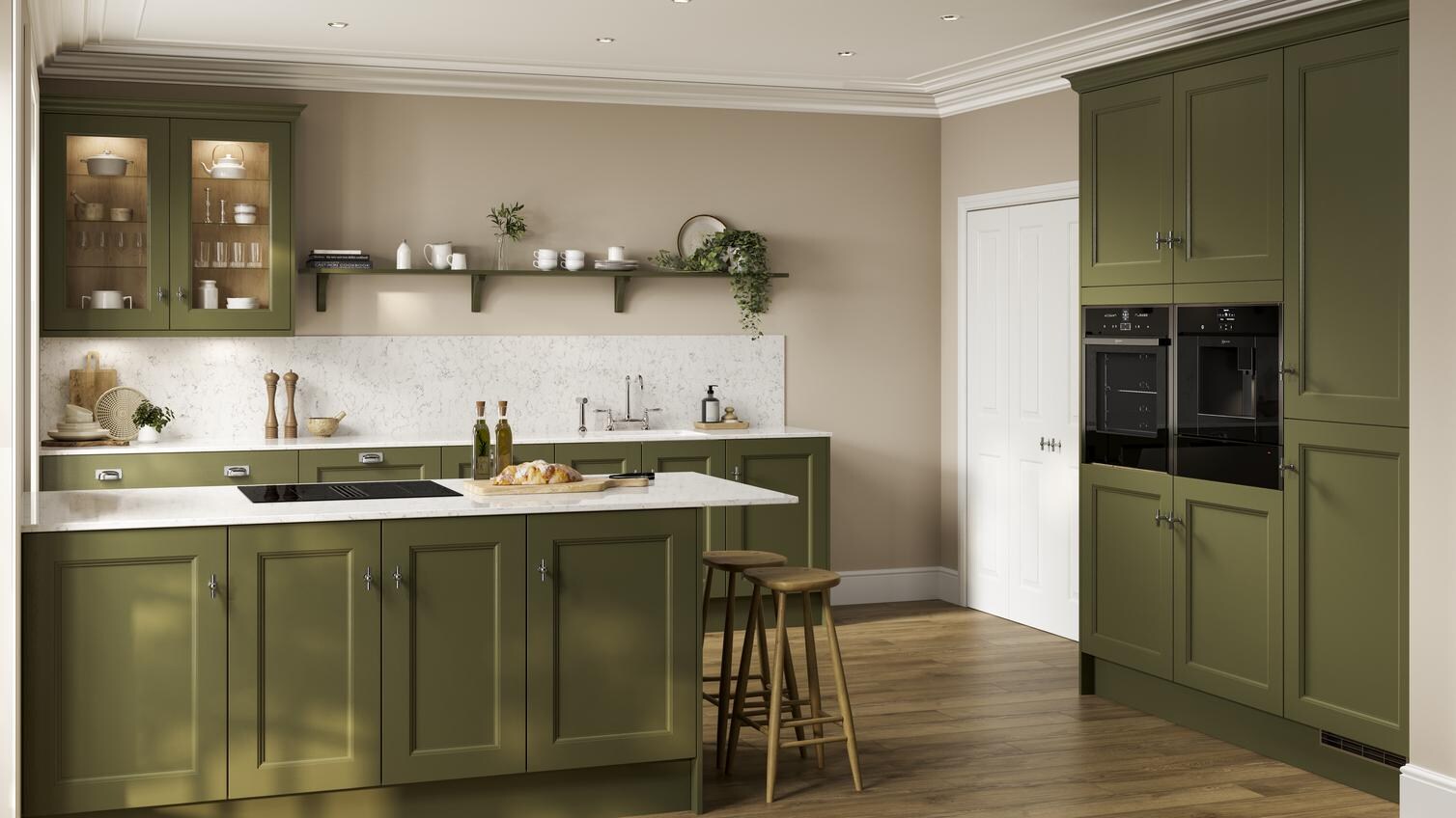 An olive-toned, dark green kitchen in a shaker design. There is a kitchen island, white worktop, and matching upstand.