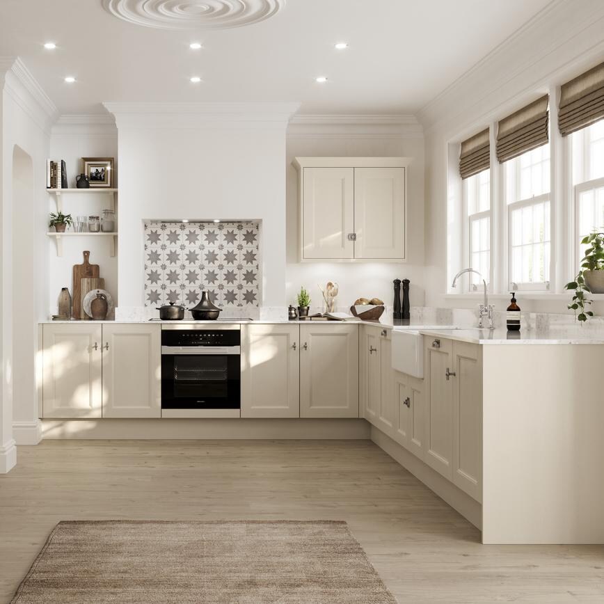 A cream, Linen kitchen in an L-shaped layout and dresser unit in dining area. It has oak-style flooring and a Butler sink.
