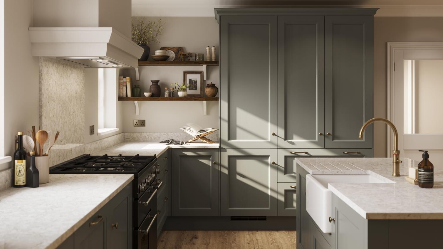 A green kitchen with shaker doors in an island layout. It has beige worktops, dark timber shelving, and plank flooring.