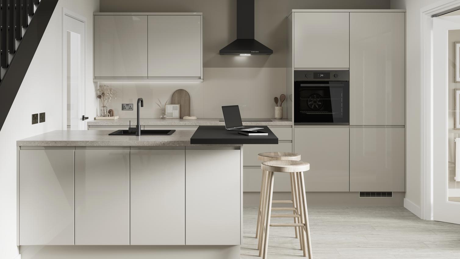 A minimal sandstone kitchen design with gloss, integrated handle doors and matt black features, such as a tap and extractor.