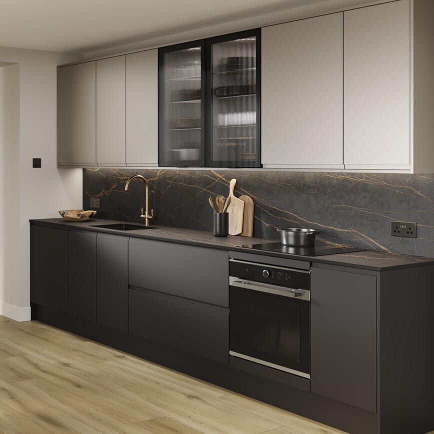 A titanium kitchen with a metallic effect and matt finish. There is a black marble-style backsplash and black base units. 