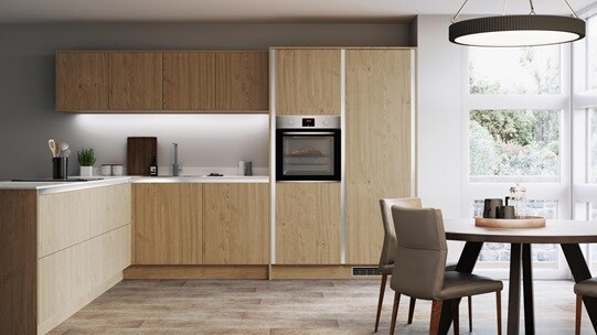 Natural oak handleless kitchen with white worktop, single built in oven and round dining table with garden view,