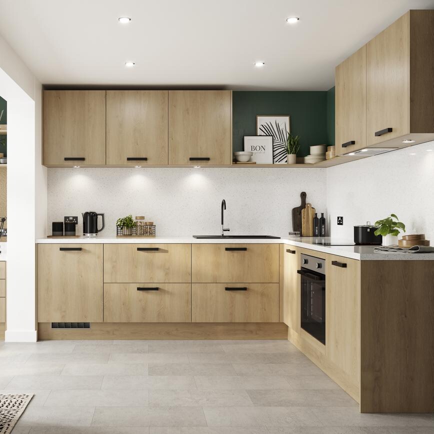 Natural oak l-shape kitchen with white kitchen worktops, black handles, and downlights. Includes an adjoining office space.