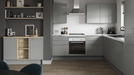 Small l-shape kitchen with grey slab doors and copper trims for a handleless look. Has a single oven and a silver extractor.