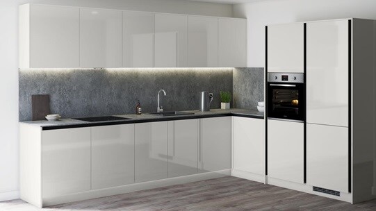 Modern grey gloss kitchen with industrial look grey worktop, matching splashback in an l shape with full height wall units.