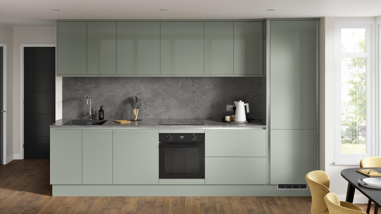 A single wall reed green kitchen, in a gloss finish. It has handleless doors, dark stone backsplash, and dark oak flooring.