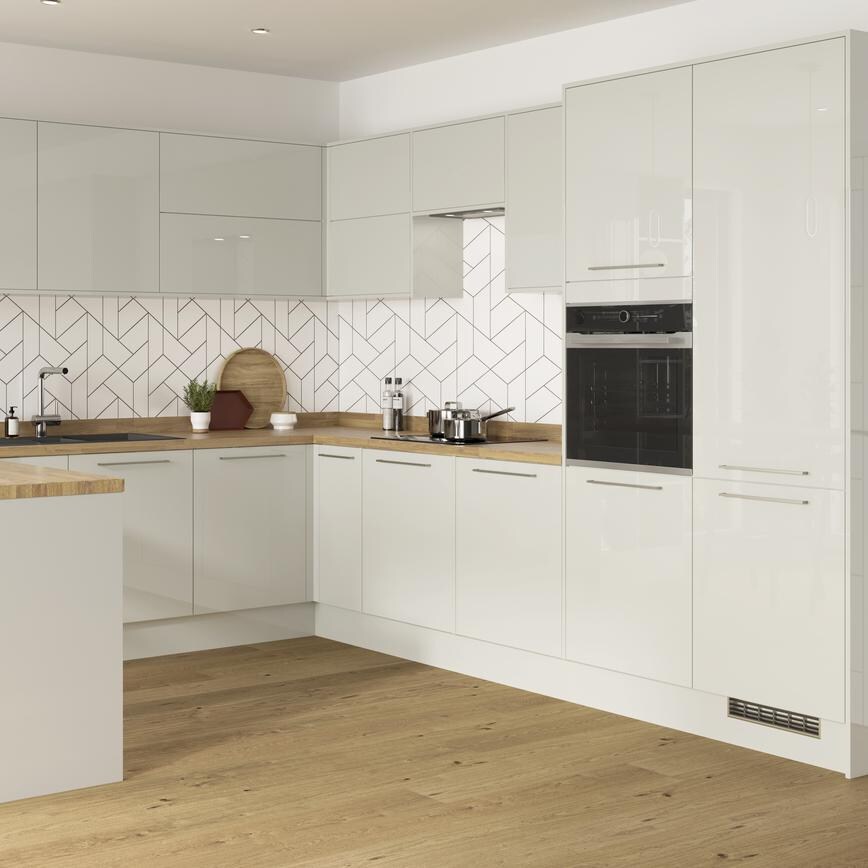 Dove grey reflective mirror gloss kitchen in a u shape with integrated breakfast bar and chrome kitchen door handles.
