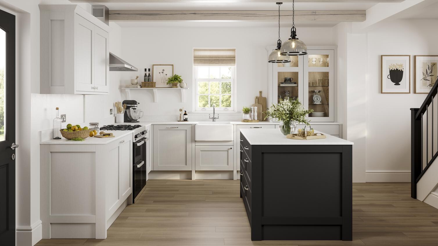 A Halesworth shaker-style kitchen in a light, dove grey finish. The kitchen white worktops, and a dark-coloured kitchen island