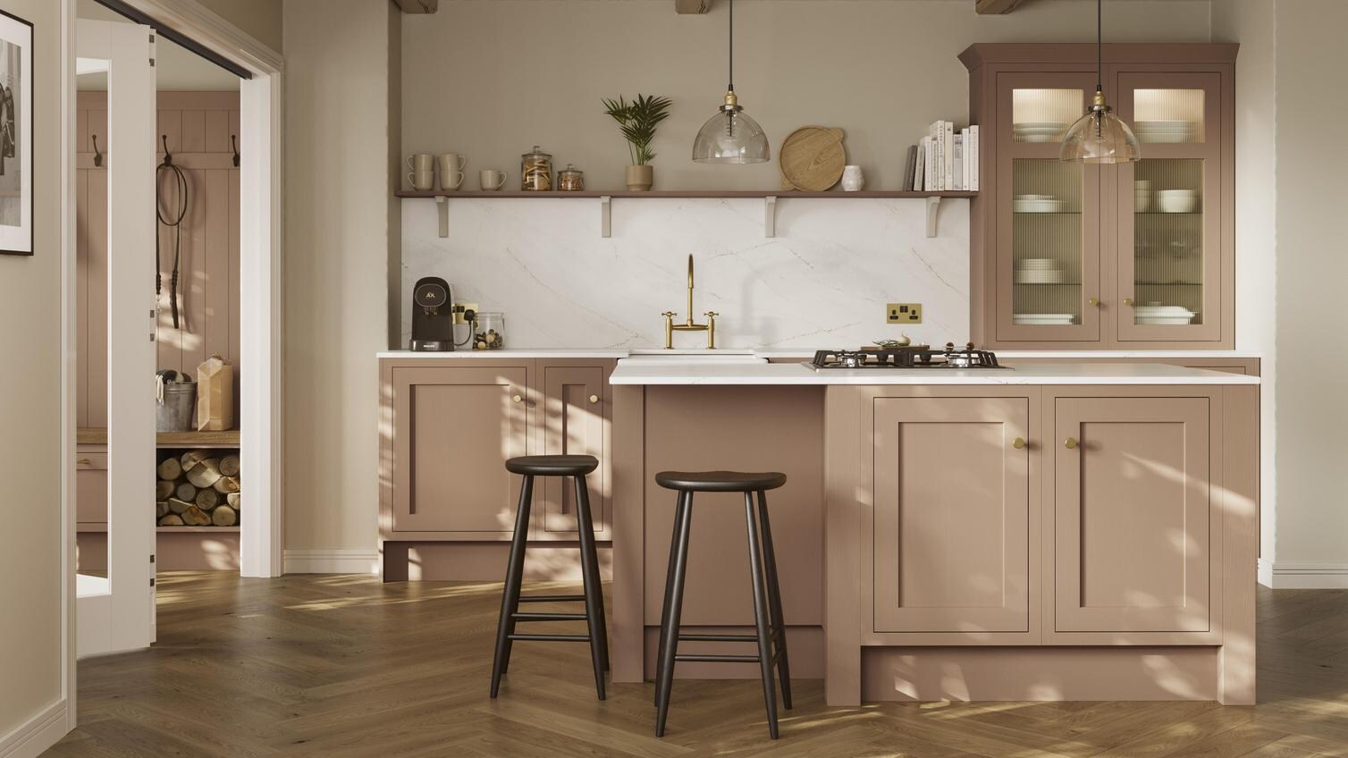 An orange shaker kitchen from Ilfracombe Terracotta, in a single wall layout. It has an island and herringbone, oak flooring