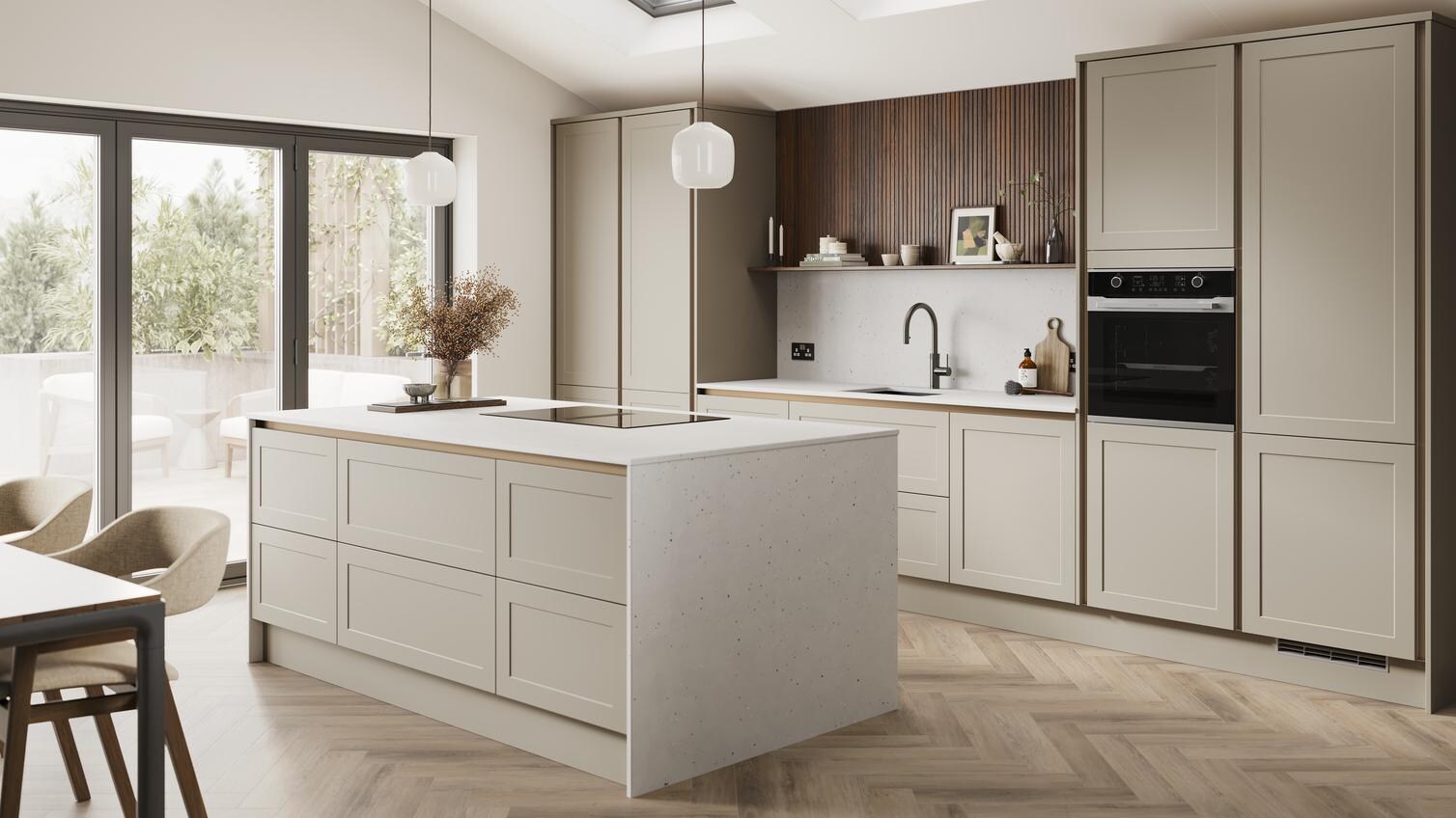A handleless, sanstone shaker kitchen island in a matt finish. It has quartz worktops with side panels and backboard. 