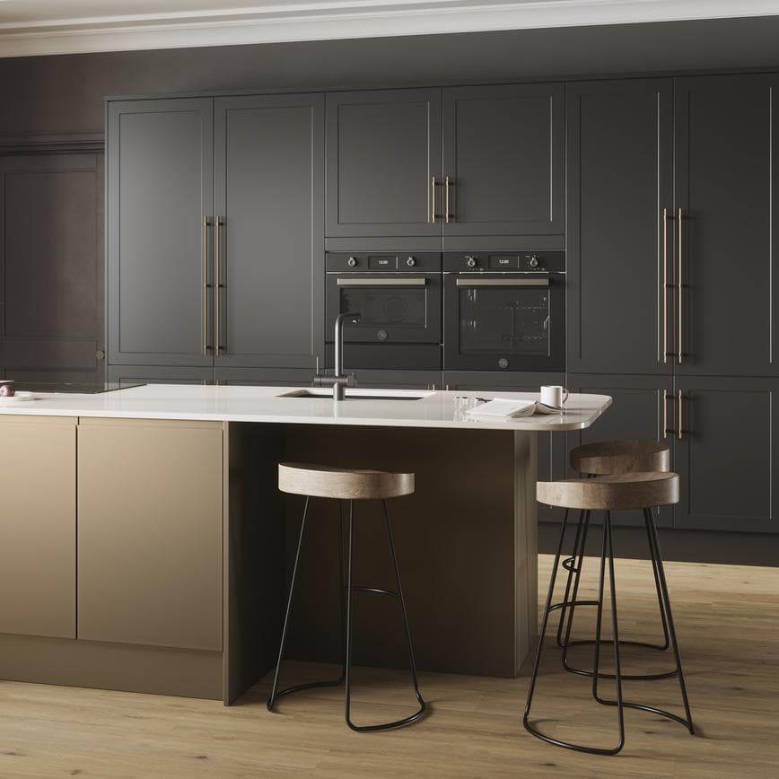 A Frome kitchen island layout, with charcoal black units and matt metallic island units. It is finished with oak flooring.