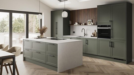An ash green, shaker kitchen island layout in a matt finish. It has quartz worktops with matching side panels and backboard. 