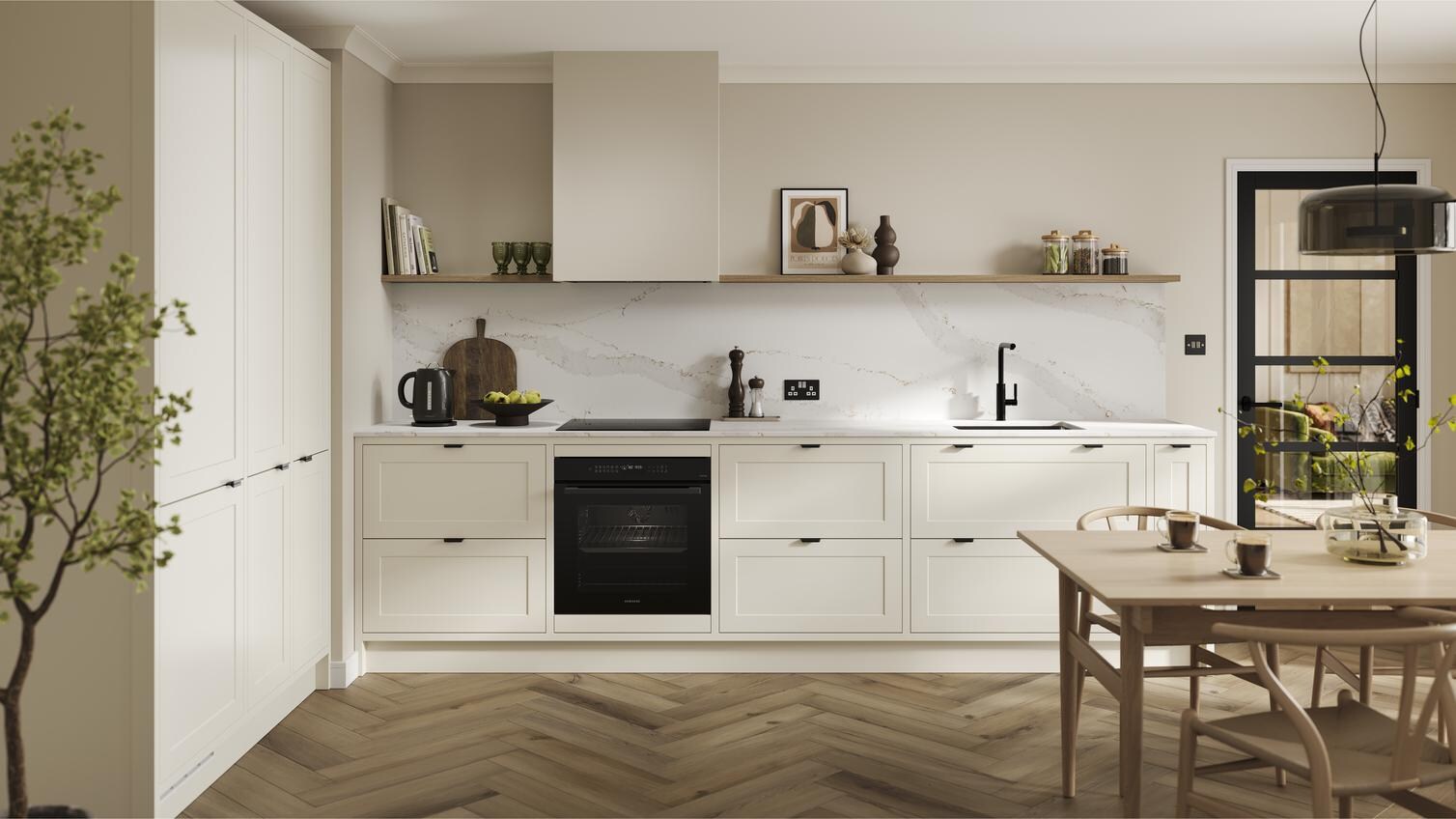 A shaker, porcelain kitchen in an in-frame peninsula layout from the Frome range. It has oak flooring & green wall cabinets.