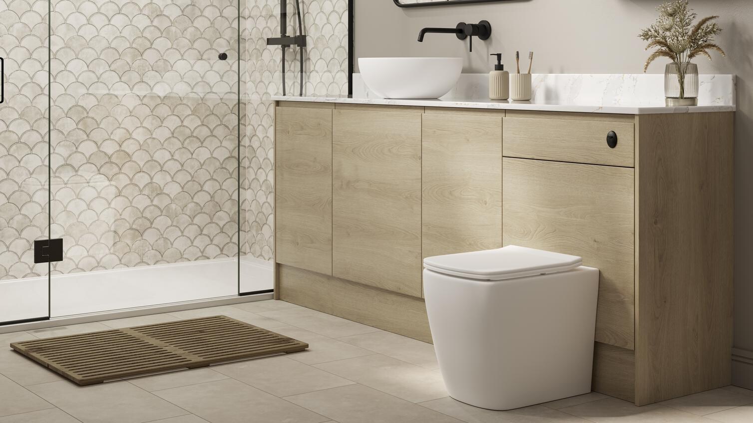 A Clerkenwell natural oak bathroom, with shower. It has a matching cistern cabinet, black accessories, & marble countertop.
