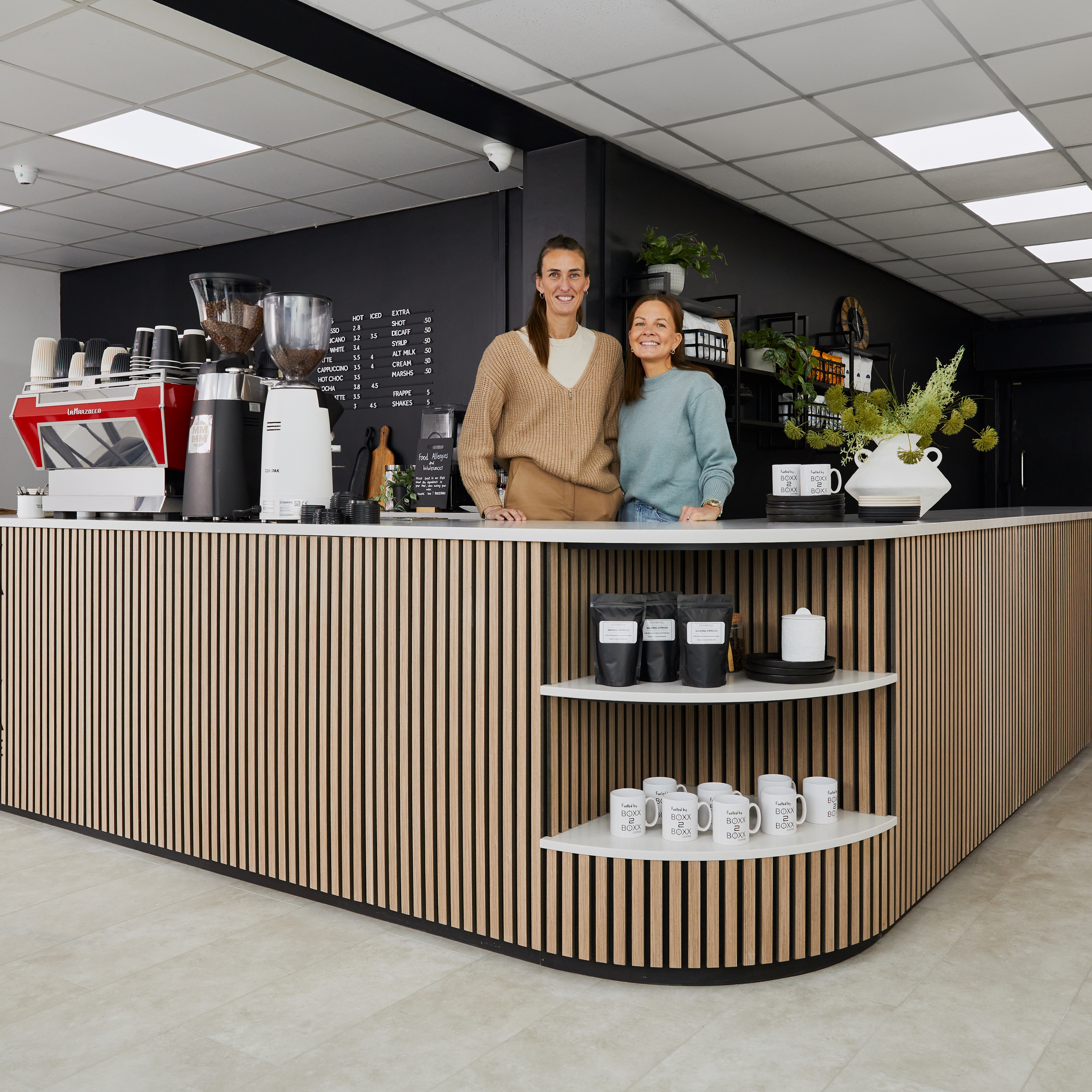 Jill and Shelly stood behind the counter of Boxx2Boxx