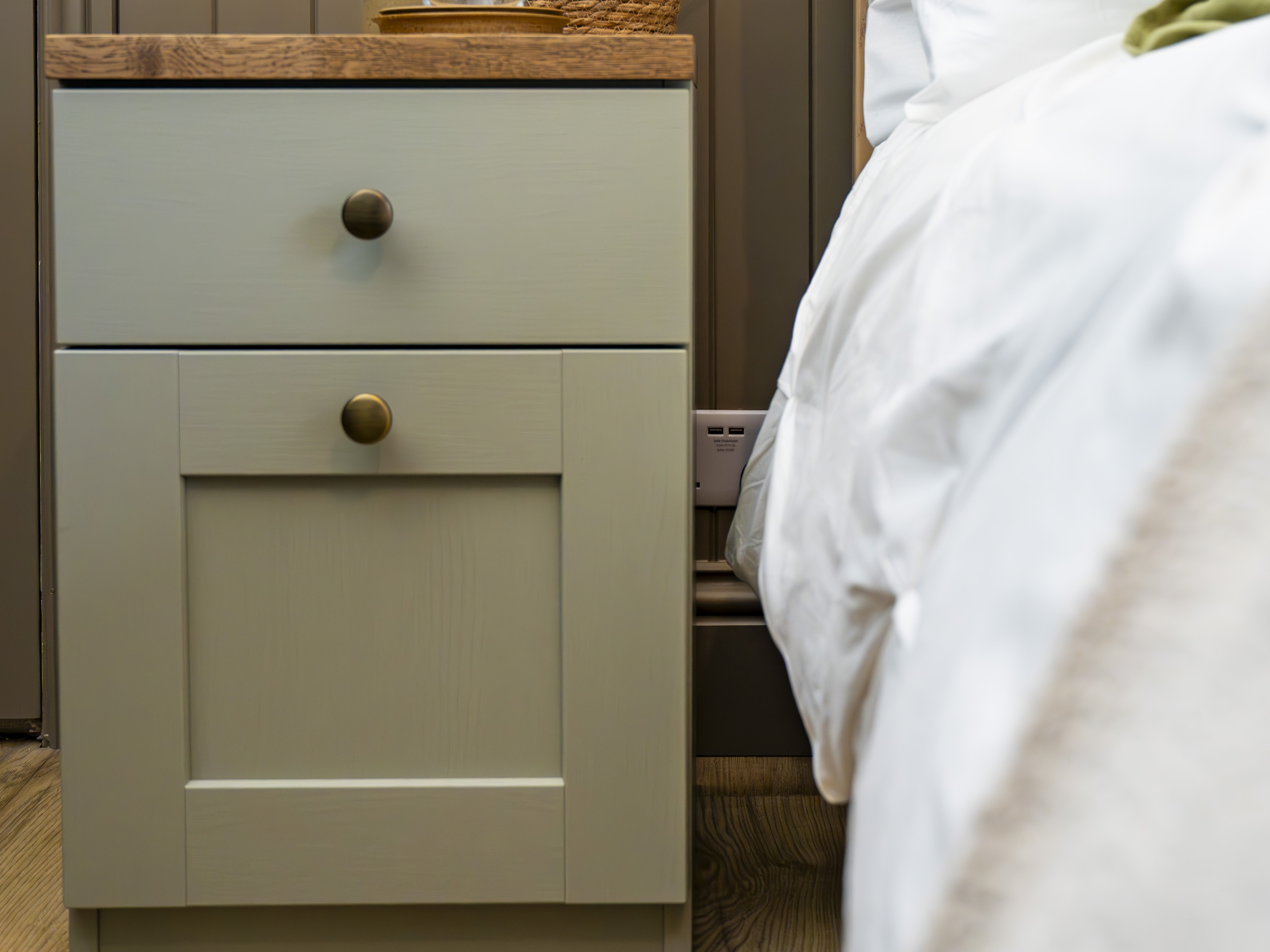 A green bedside table unit