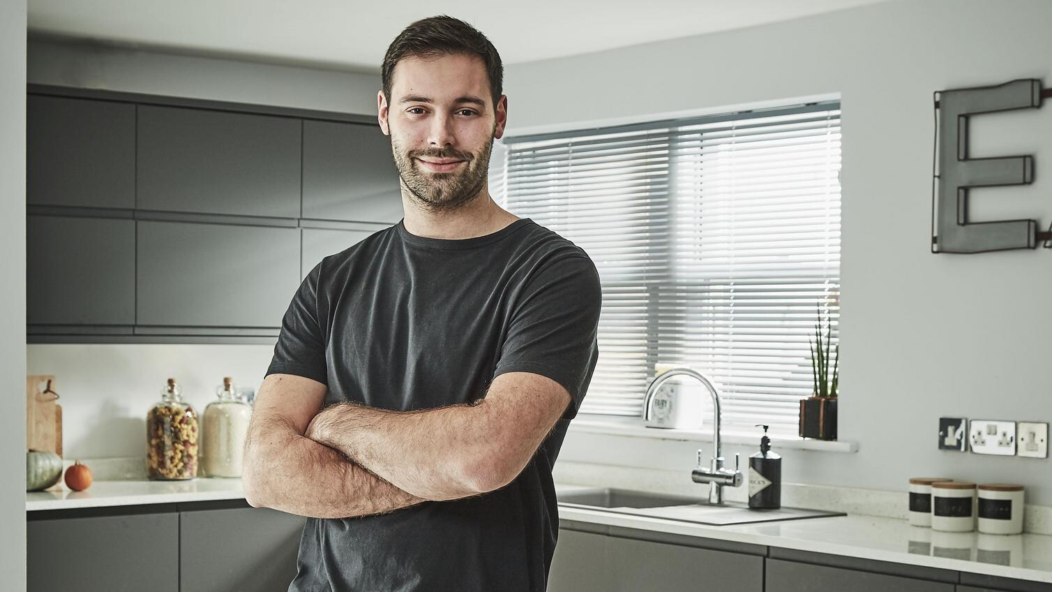 Builder in a completed kitchen