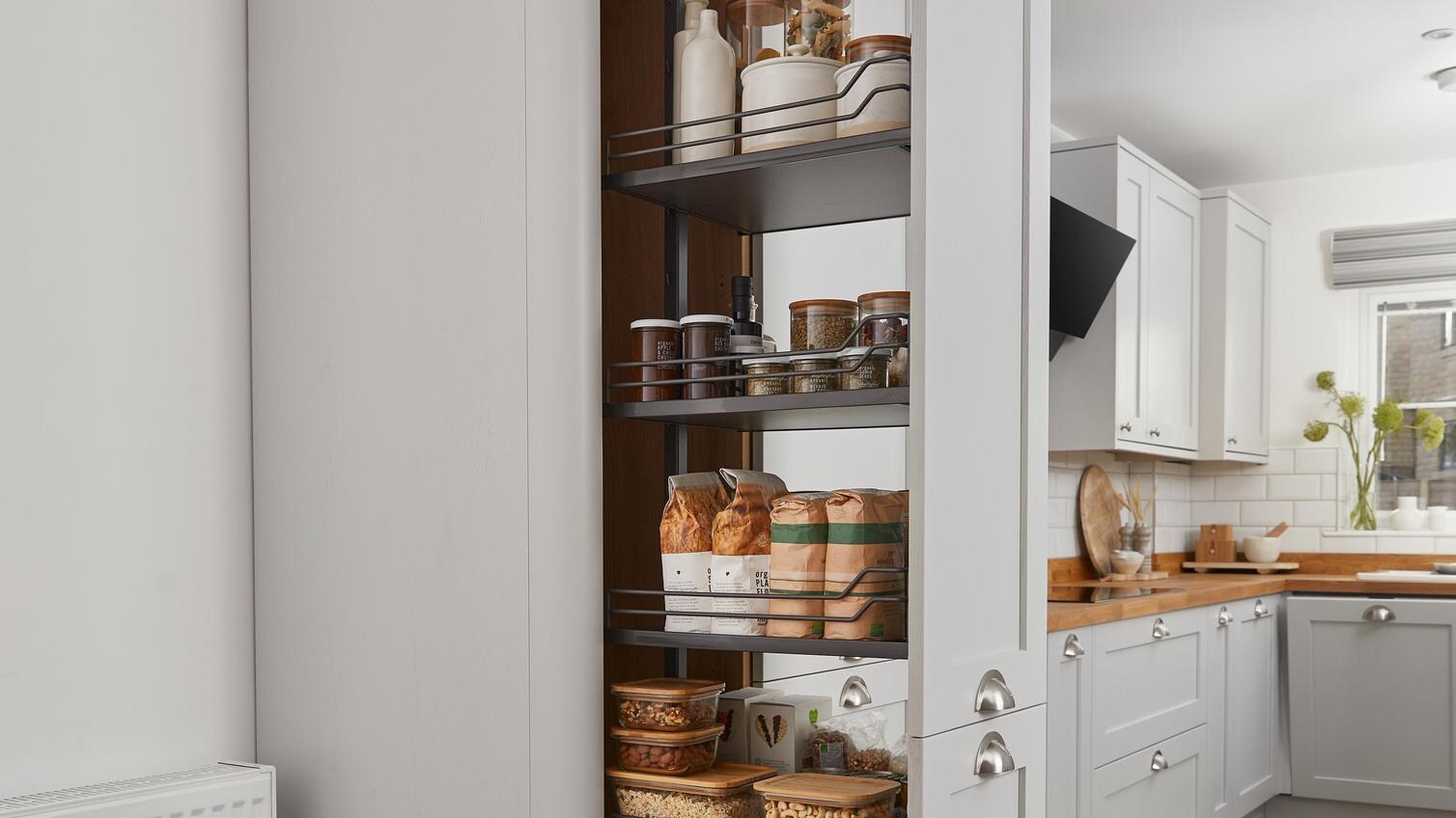 A tower storage unit with pull out shelving
