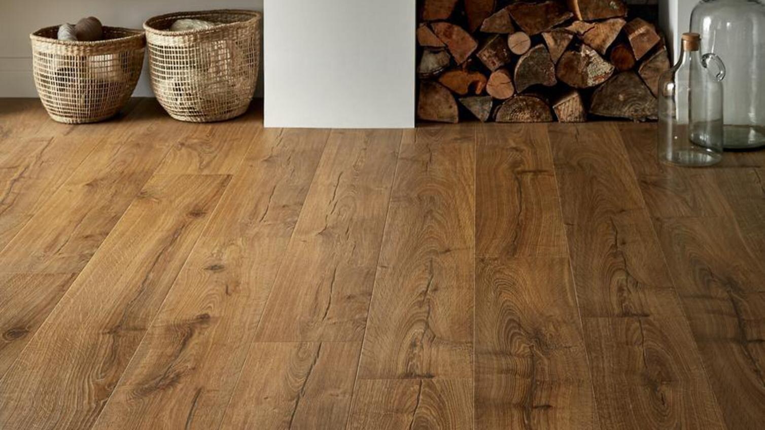 Stylish laminate flooring in a white living room with a real fireplace