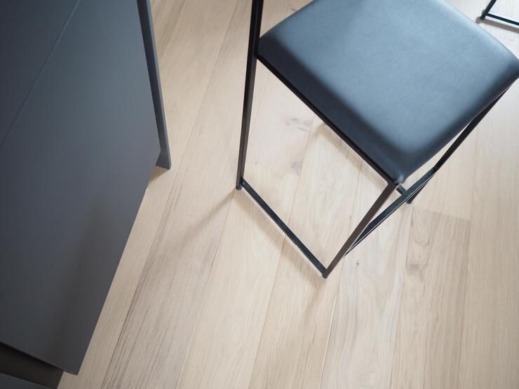 Wood flooring a matt black kitchen