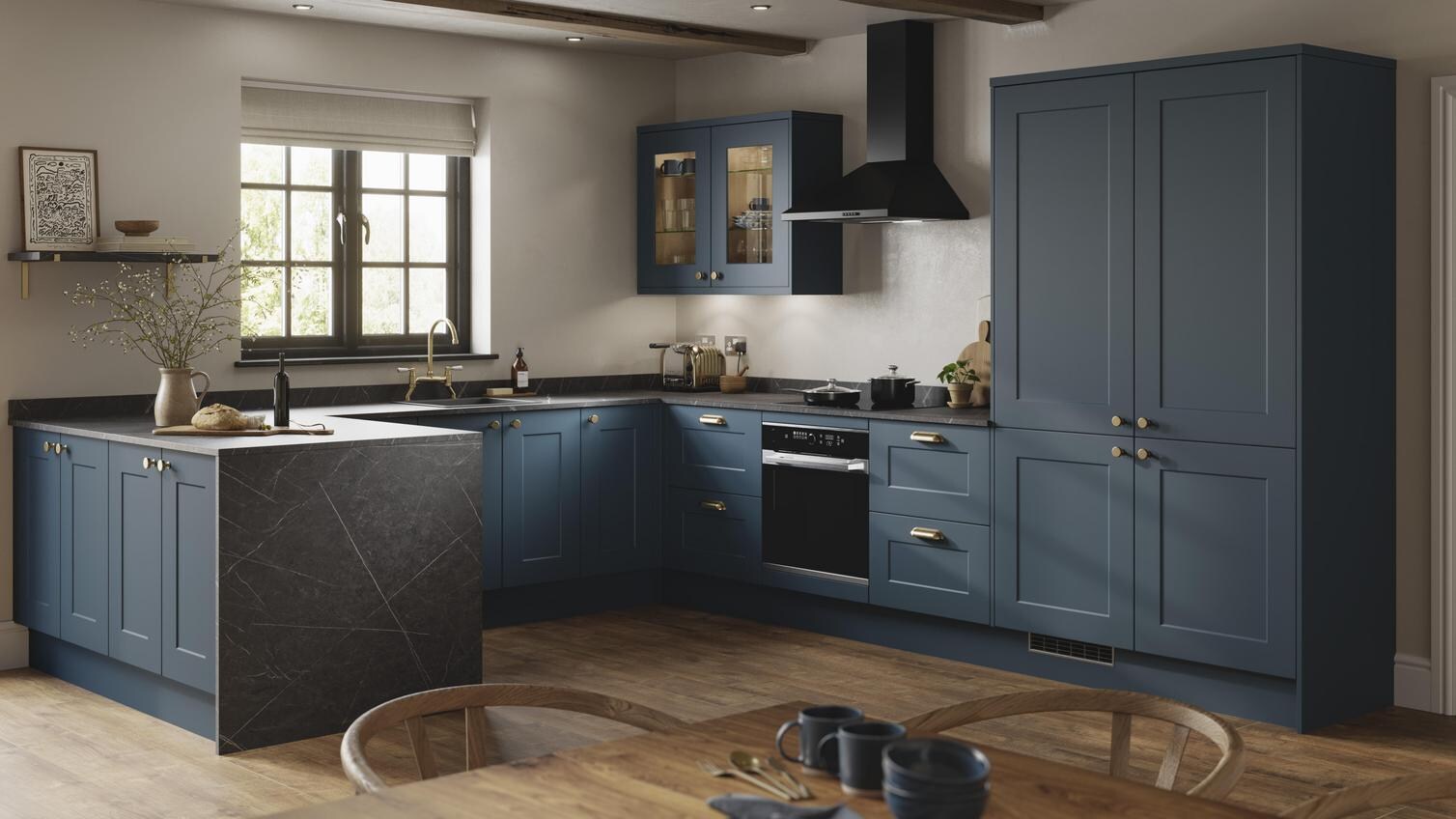 Modern marine blue kitchen with shaker door fronts and a smooth, matt finish. Includes black bar-handles and a white worktop.