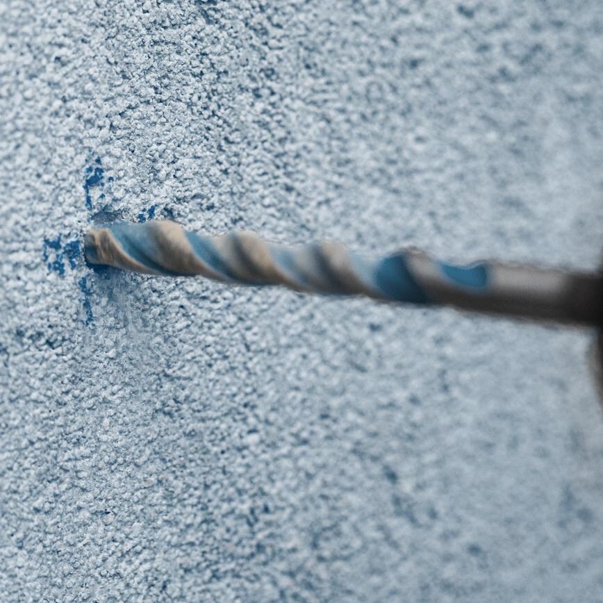 Bosch multi material drill bit drilling through brick
