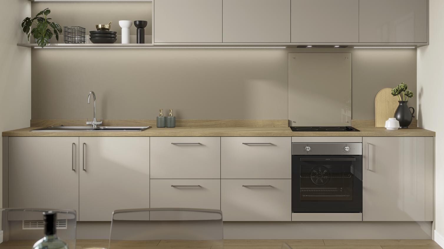 Pebble grey gloss single wall kitchen with light oak effect worktop, open shelving and built under electric oven.