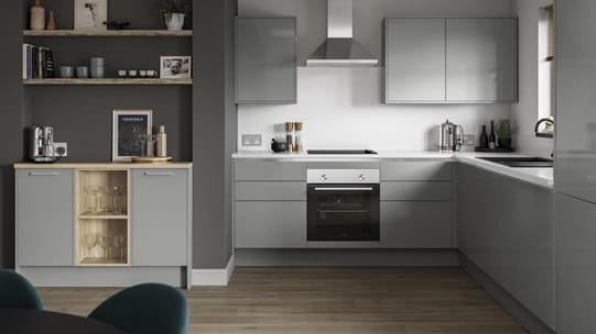 Small l-shape kitchen with grey slab doors and copper trims for a handleless look. Has a single oven and a silver extractor.